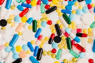 Assorted Pharmaceutical Pills and Capsules Background