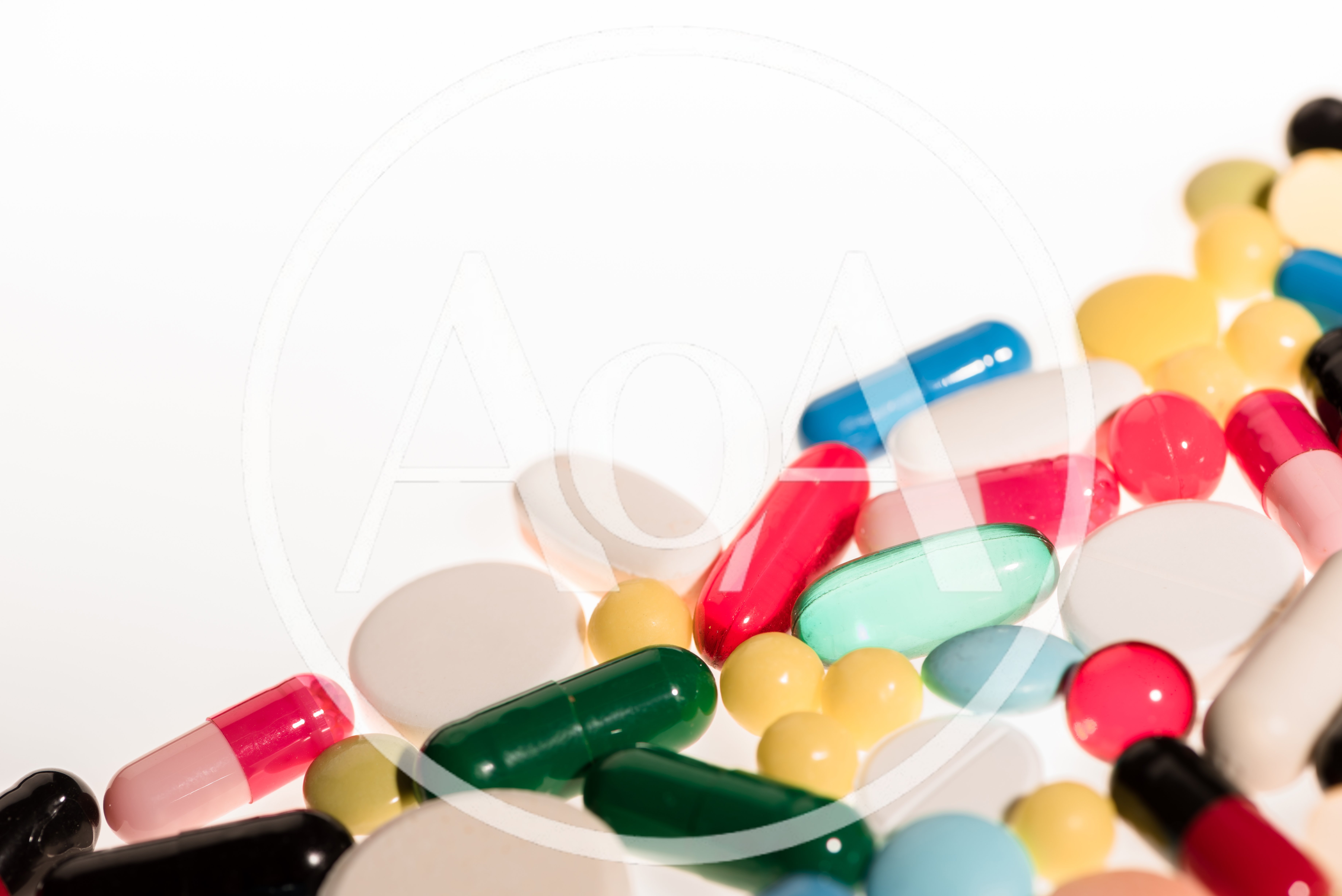 Assorted Pharmaceutical Pills and Capsules on White Background