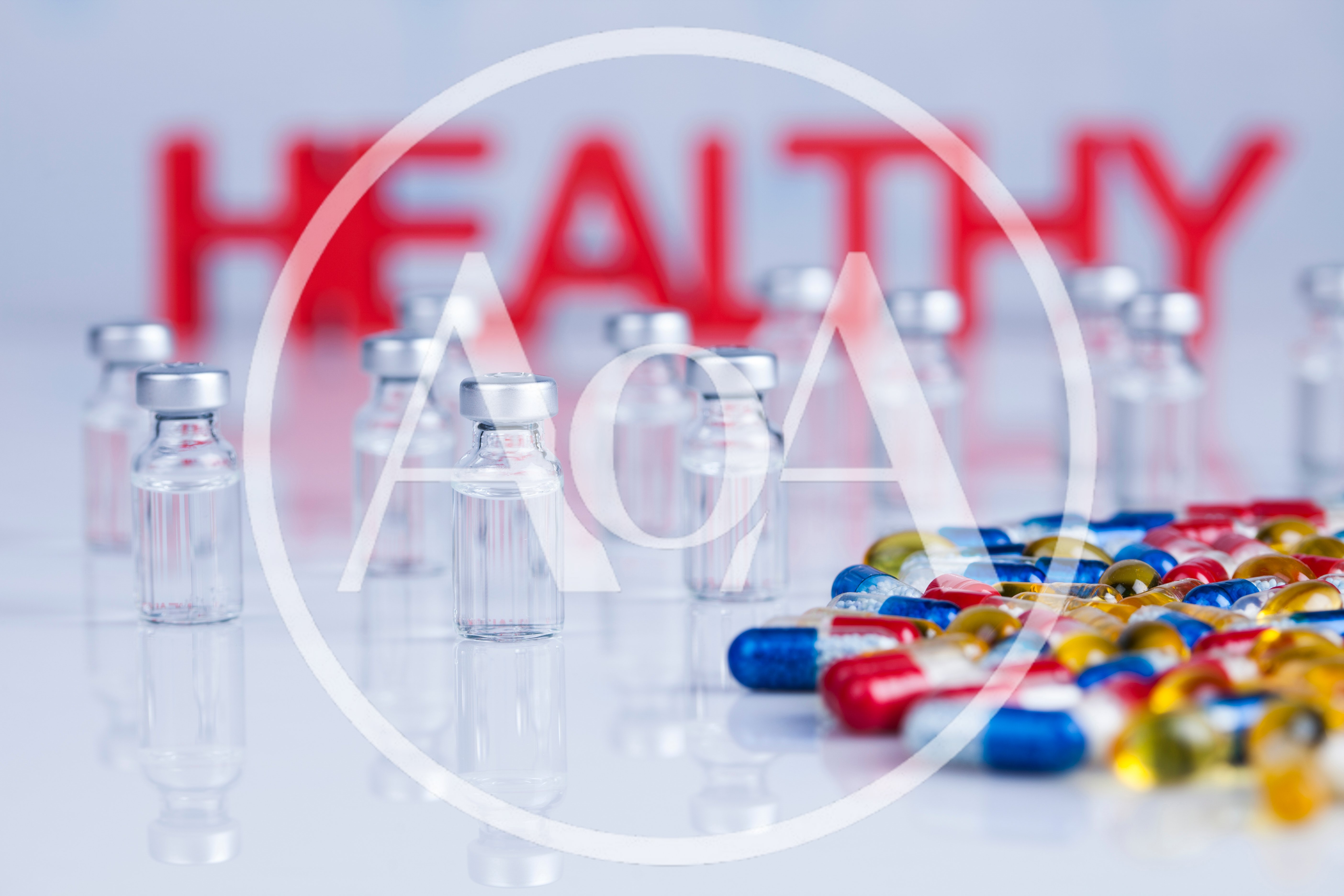 Medical Vials and Colorful Capsules with Healthy Text