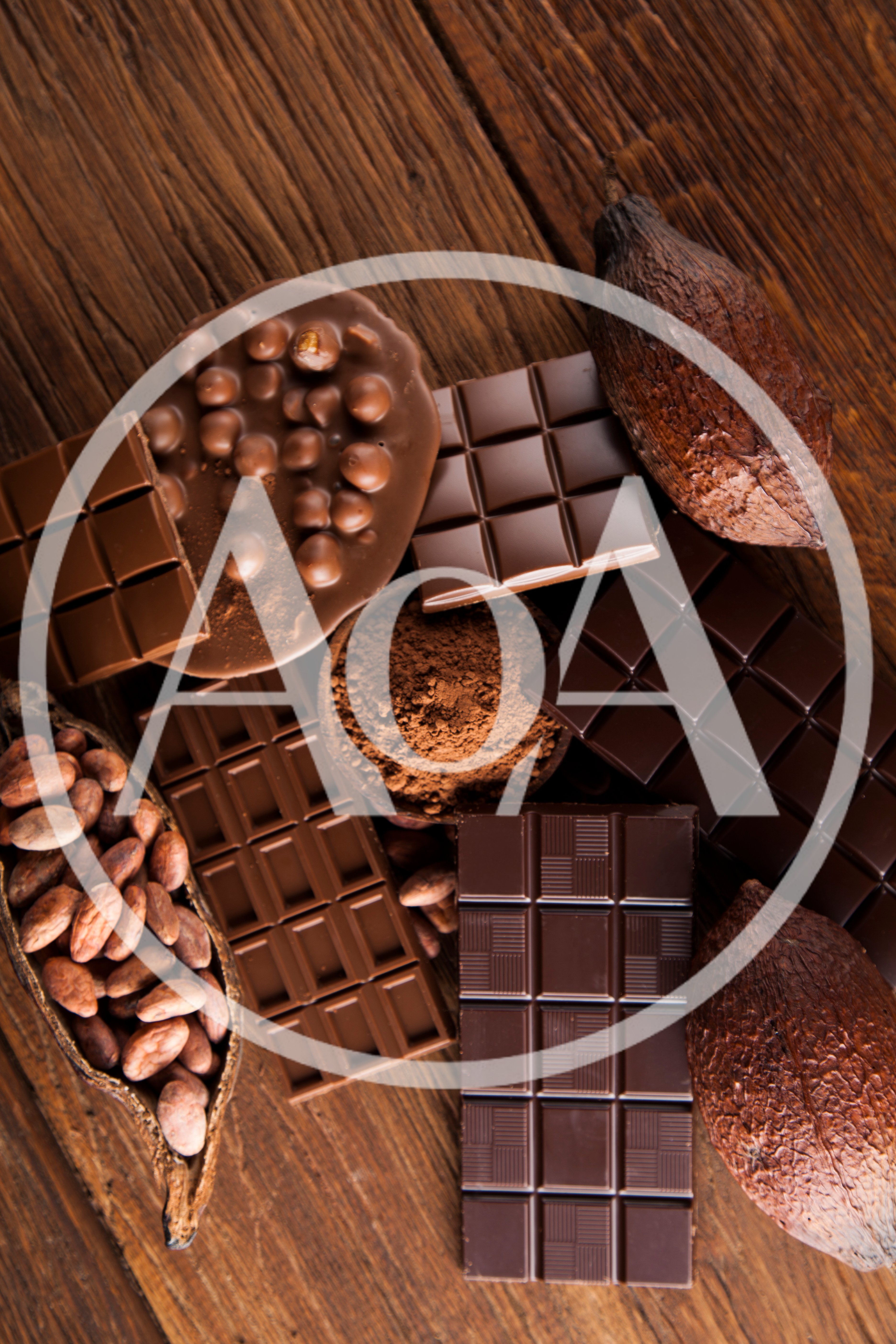 Assorted Chocolate Bars and Cocoa Beans on Wooden Table