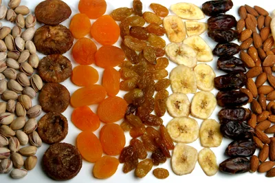 Assorted Dried Fruits And Nuts Arranged In Rows
