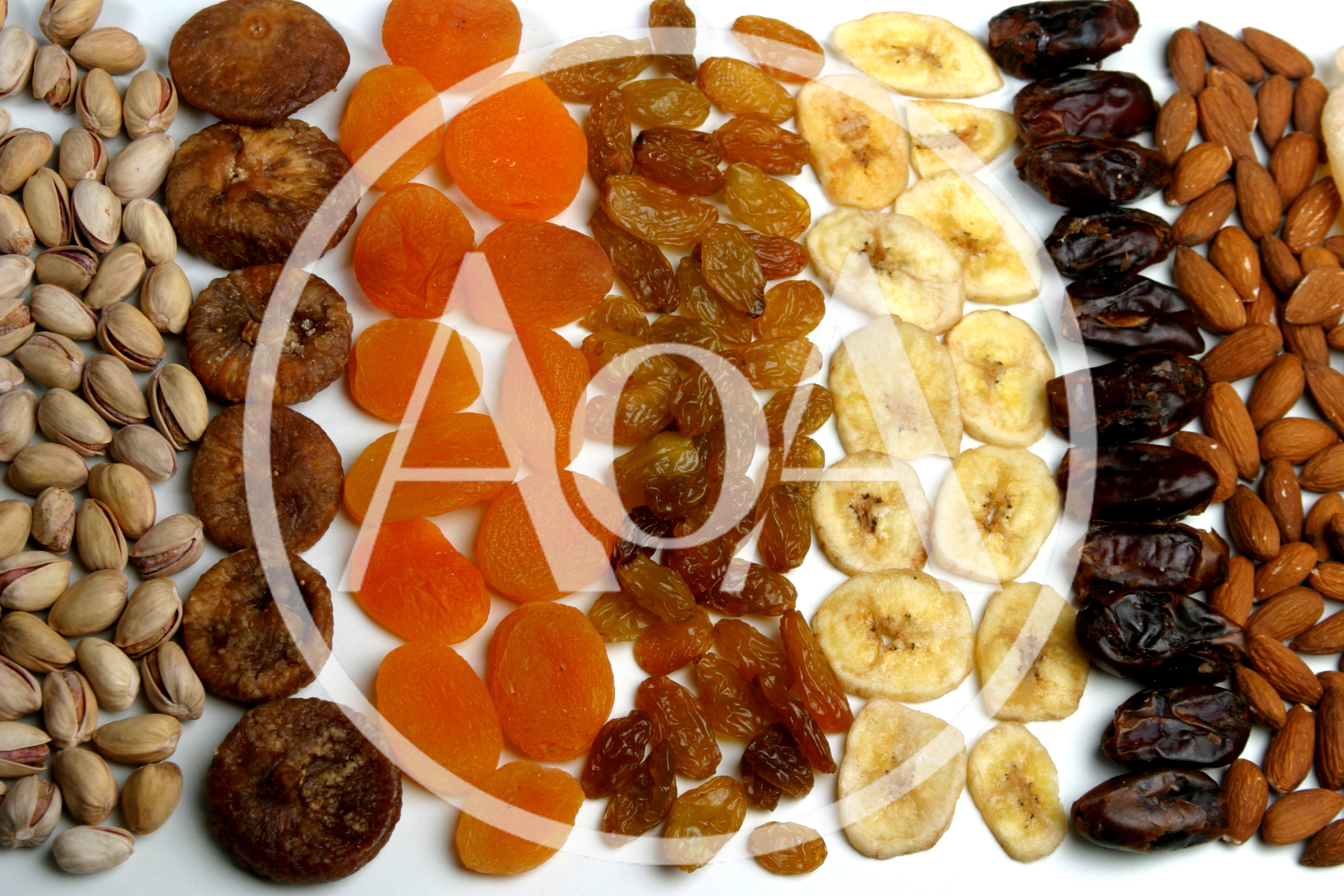 Assorted Dried Fruits And Nuts Arranged In Rows