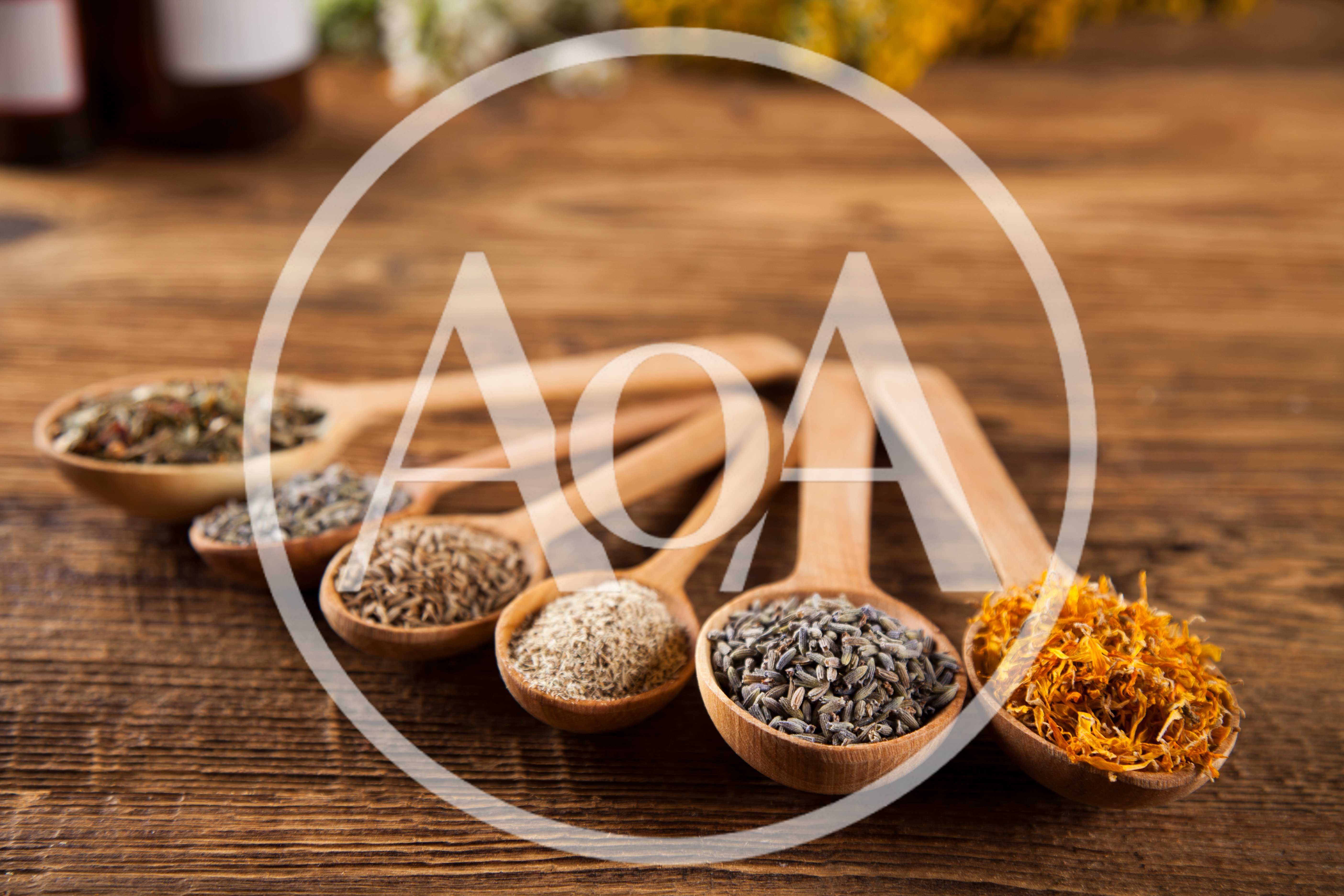 Wooden Spoons Filled With Assorted Dried Herbs And Flowers
