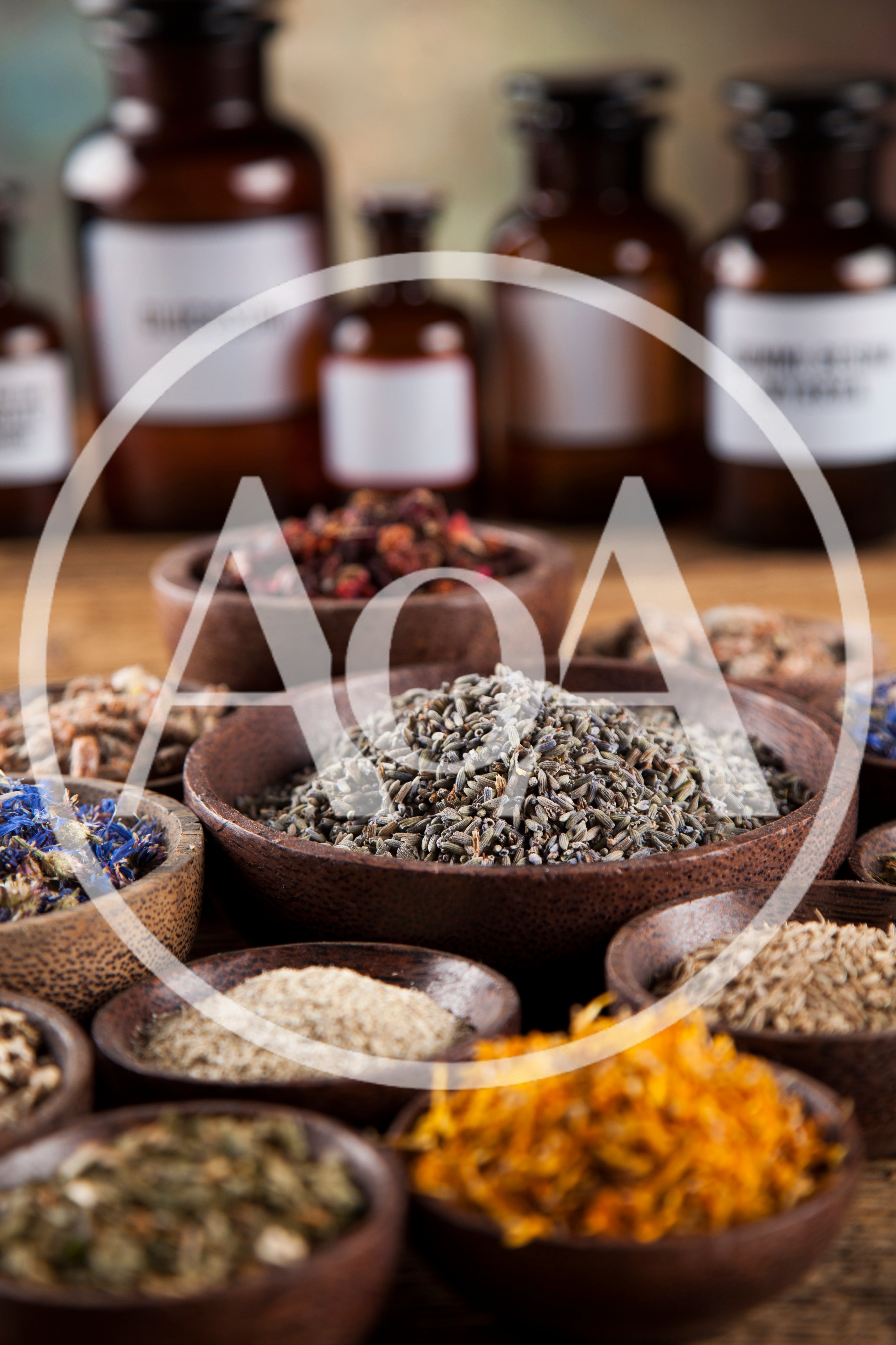 Assorted Dried Herbs And Spices In Wooden Bowls