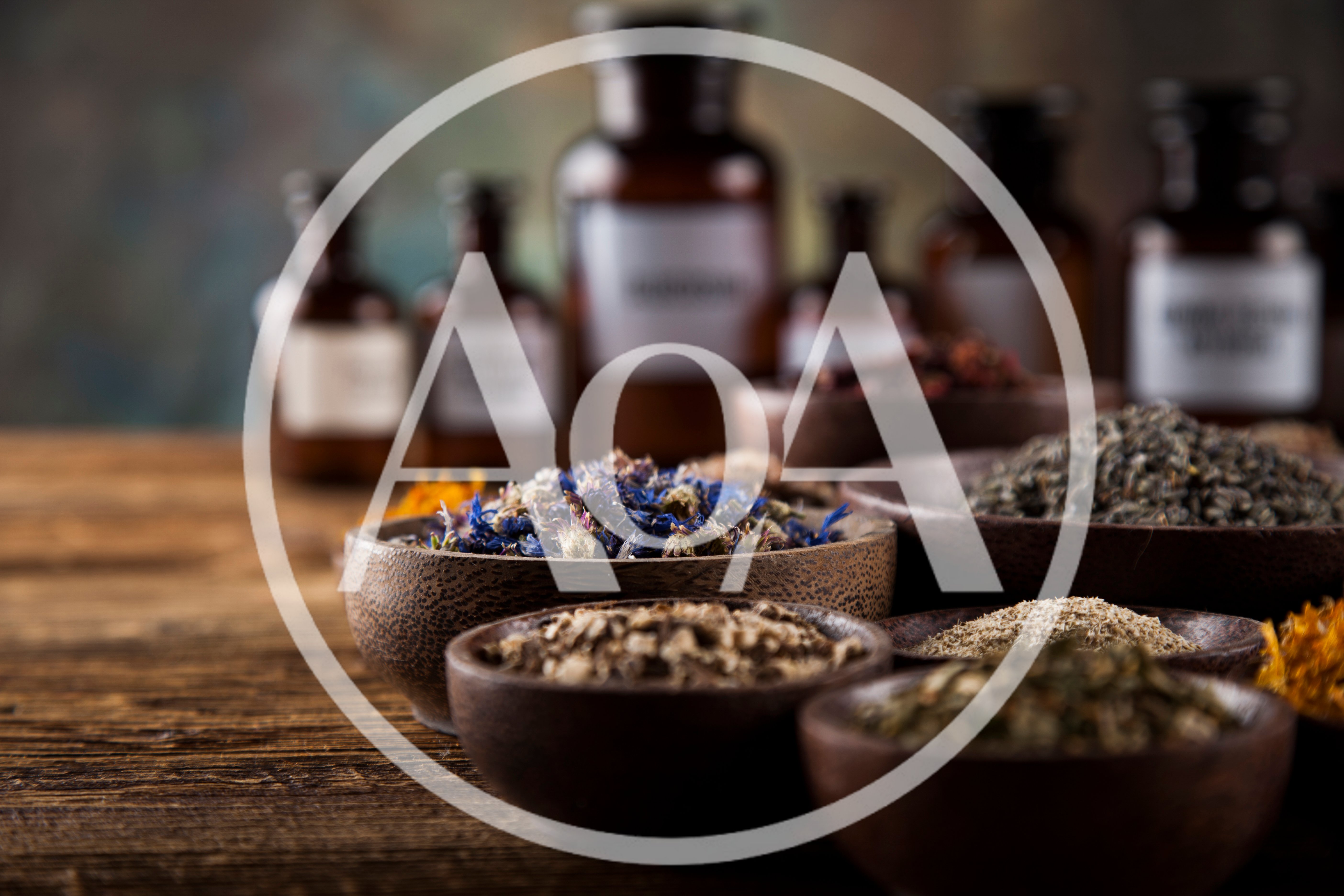 Assorted Dried Herbs and Medicinal Flowers in Wooden Bowls