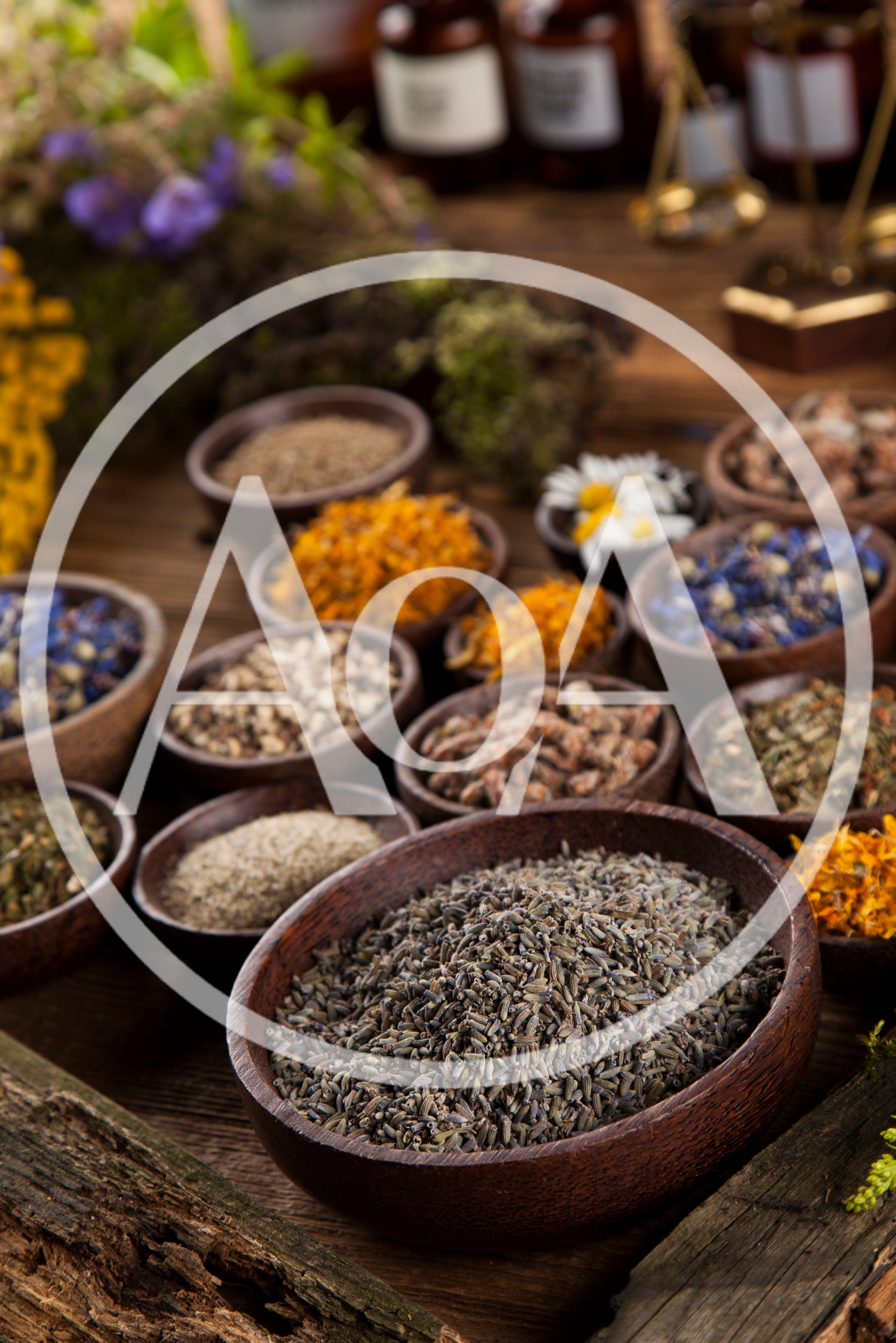 Assorted Dried Herbs and Flowers in Wooden Bowls