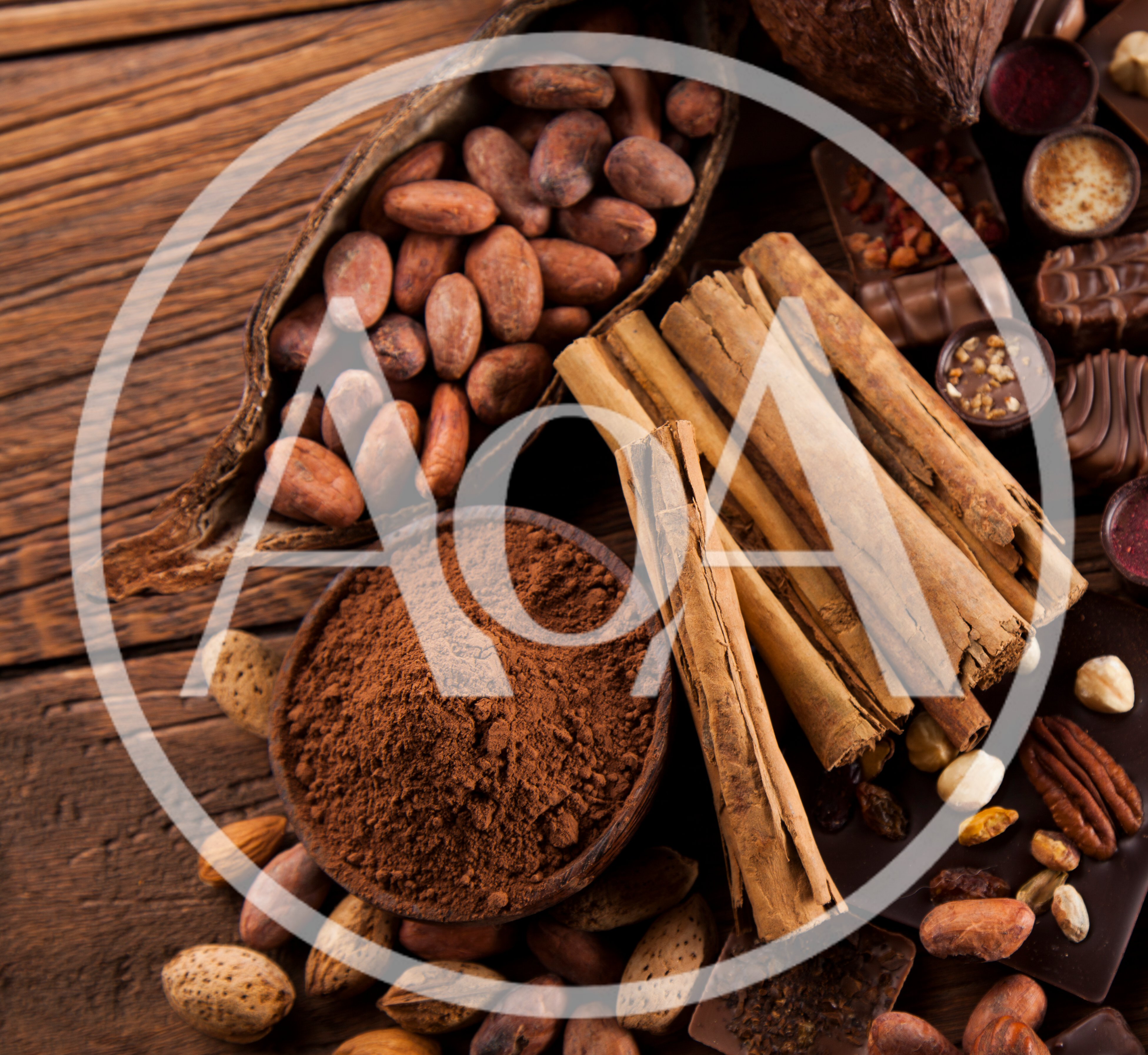 Cocoa Beans And Cinnamon Sticks On Wooden Table