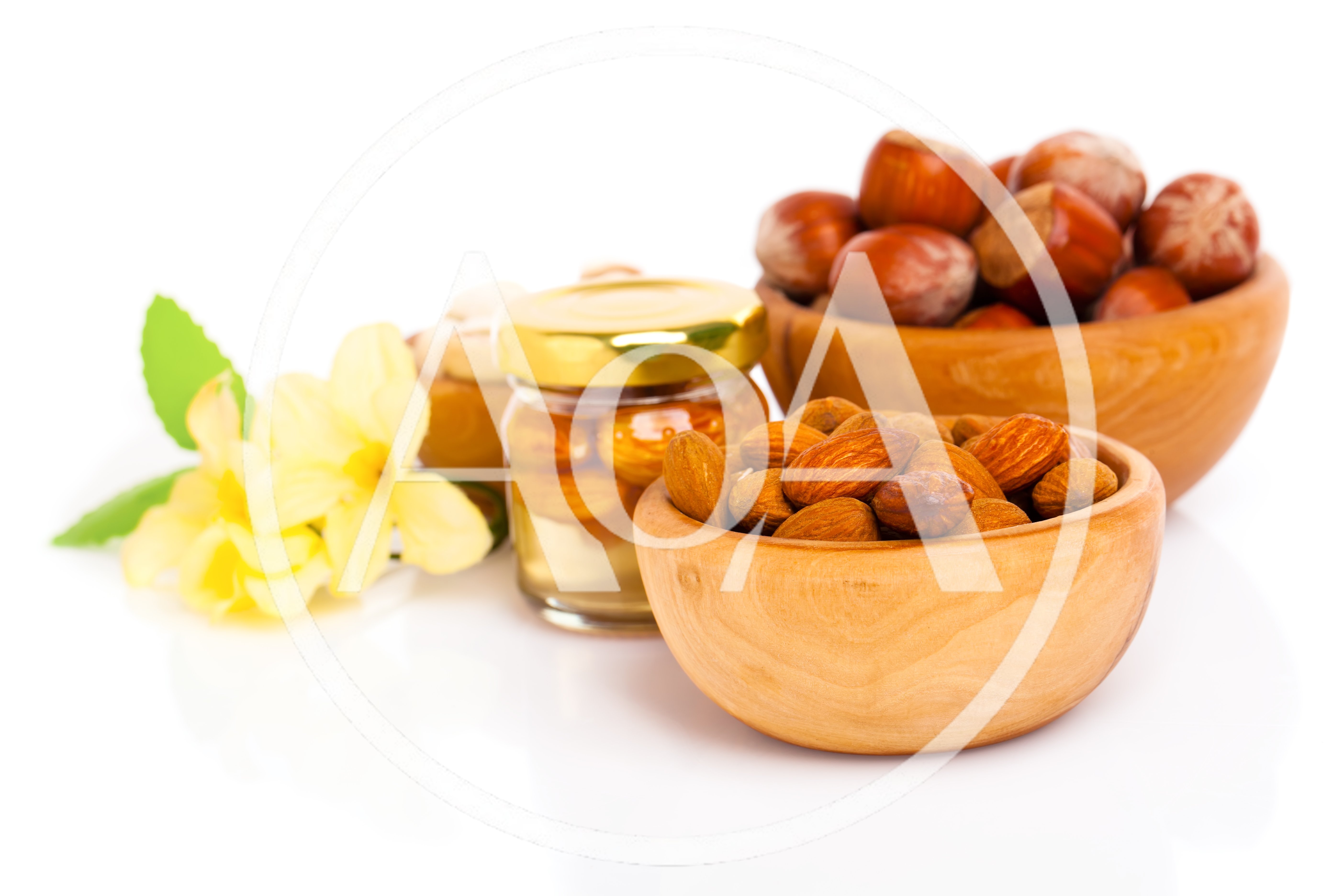 Wooden Bowls Filled With Almonds And Hazelnuts