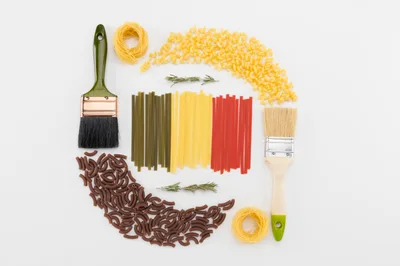Pasta Arranged As The Belgian Flag With Paintbrushes
