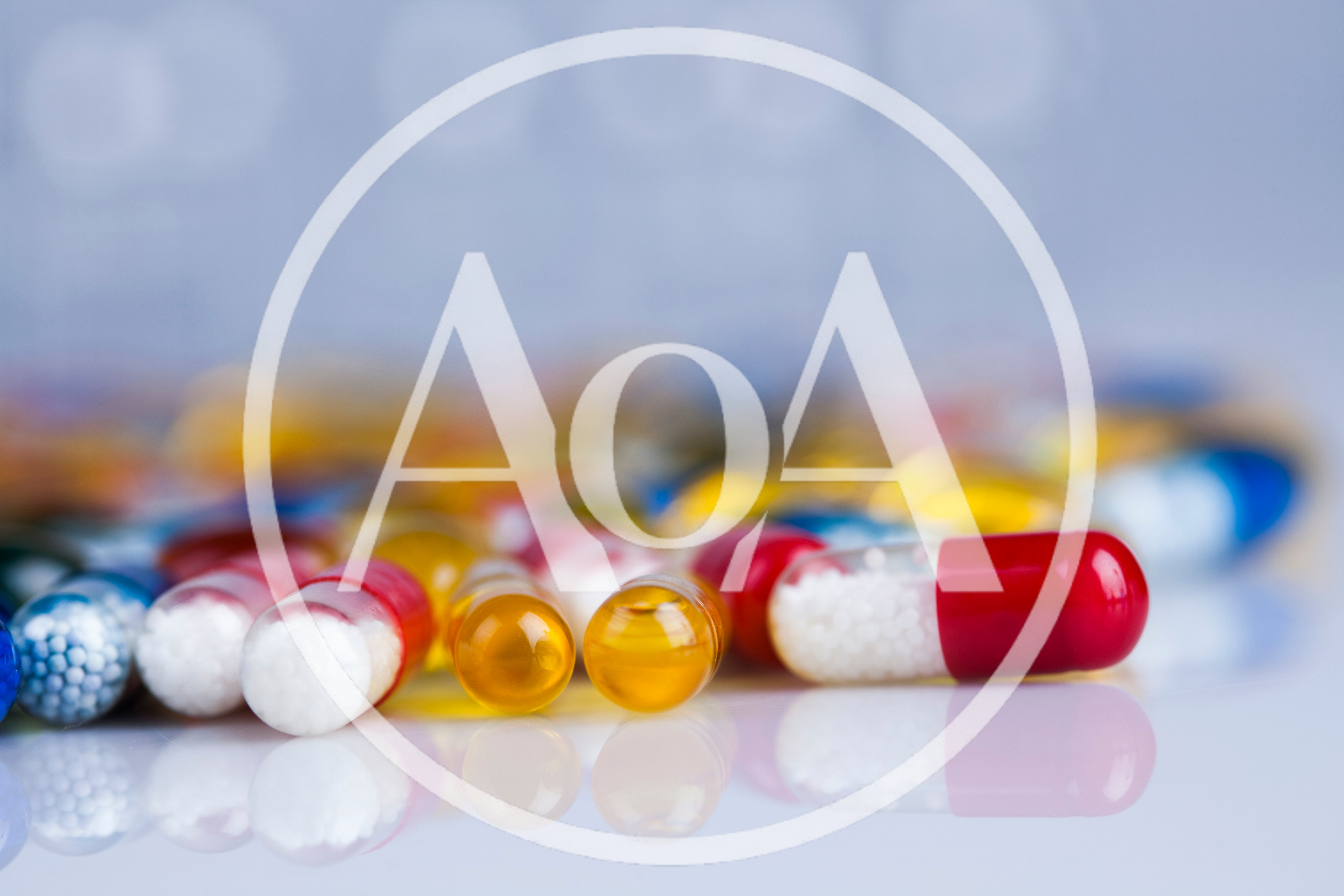 Assorted Pharmaceutical Capsules and Pills on Reflective Surface