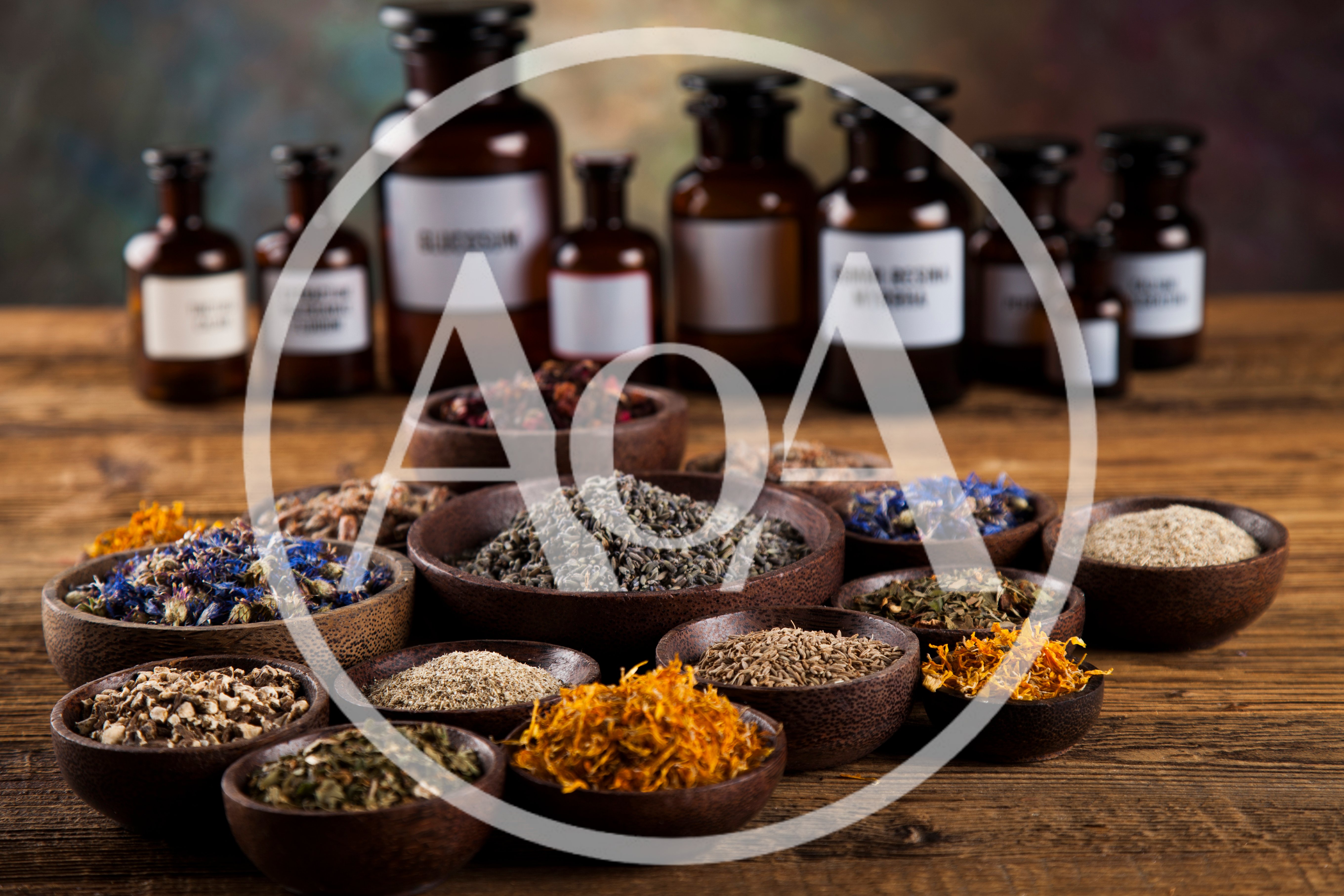Assorted Dried Herbs and Spices in Wooden Bowls