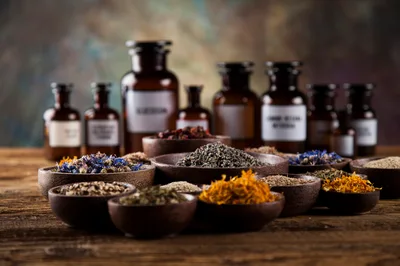 Assorted Dried Herbs and Apothecary Bottles