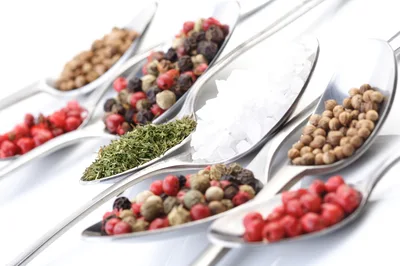 Assorted Spices and Sea Salt on Metal Spoons