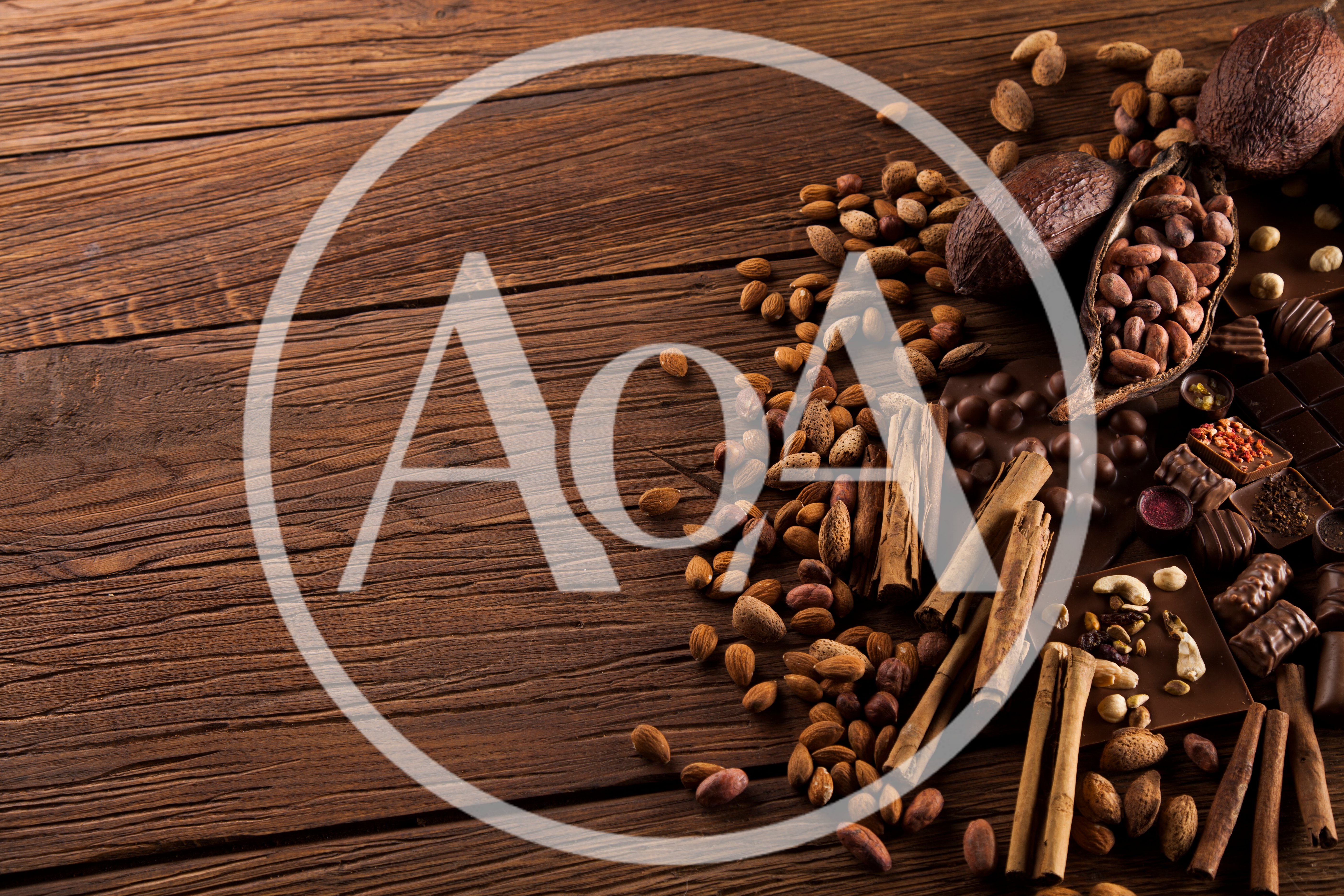 Cocoa Beans And Chocolate On Wooden Table