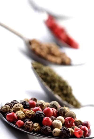 Four Spoons Filled With Various Colorful Spices