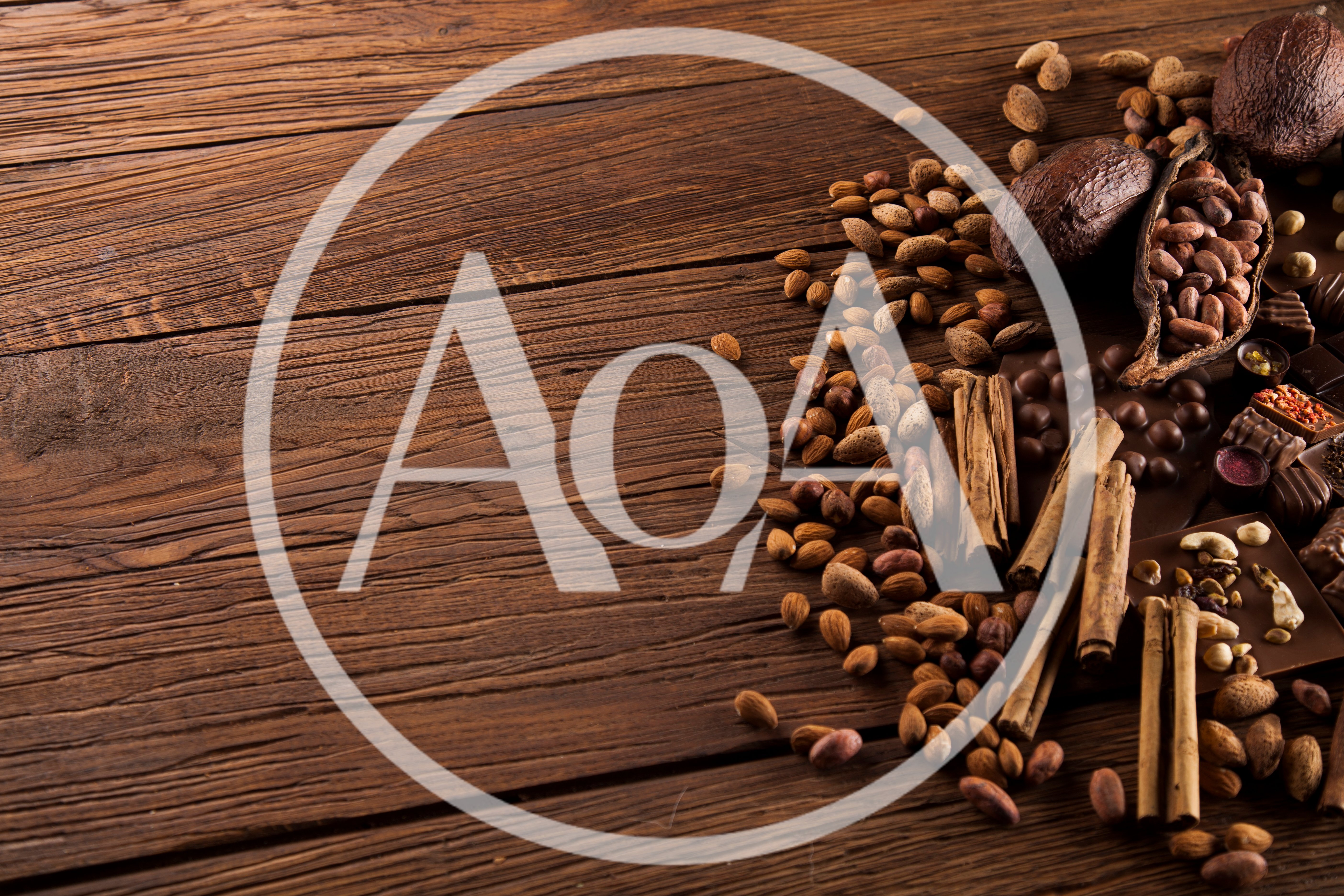 Cocoa Beans and Cinnamon Sticks on Wooden Table