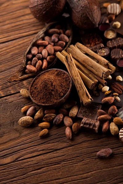 Cocoa Beans and Cinnamon Sticks on Wooden Table