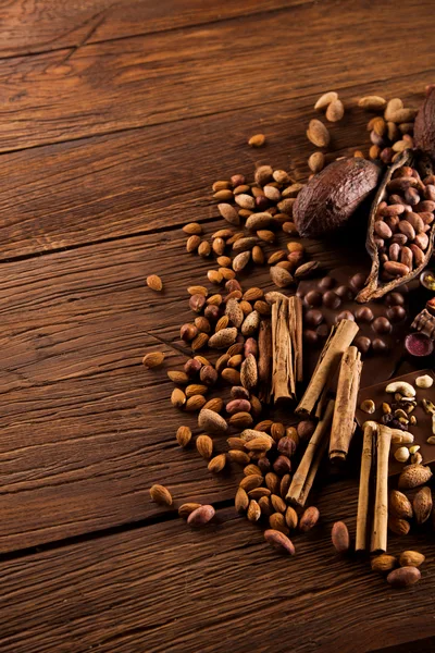 Assorted Nuts and Spices on Rustic Wooden Table