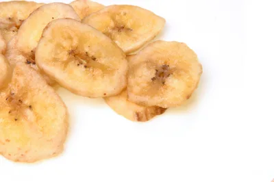 Dried Banana Chips On A White Background