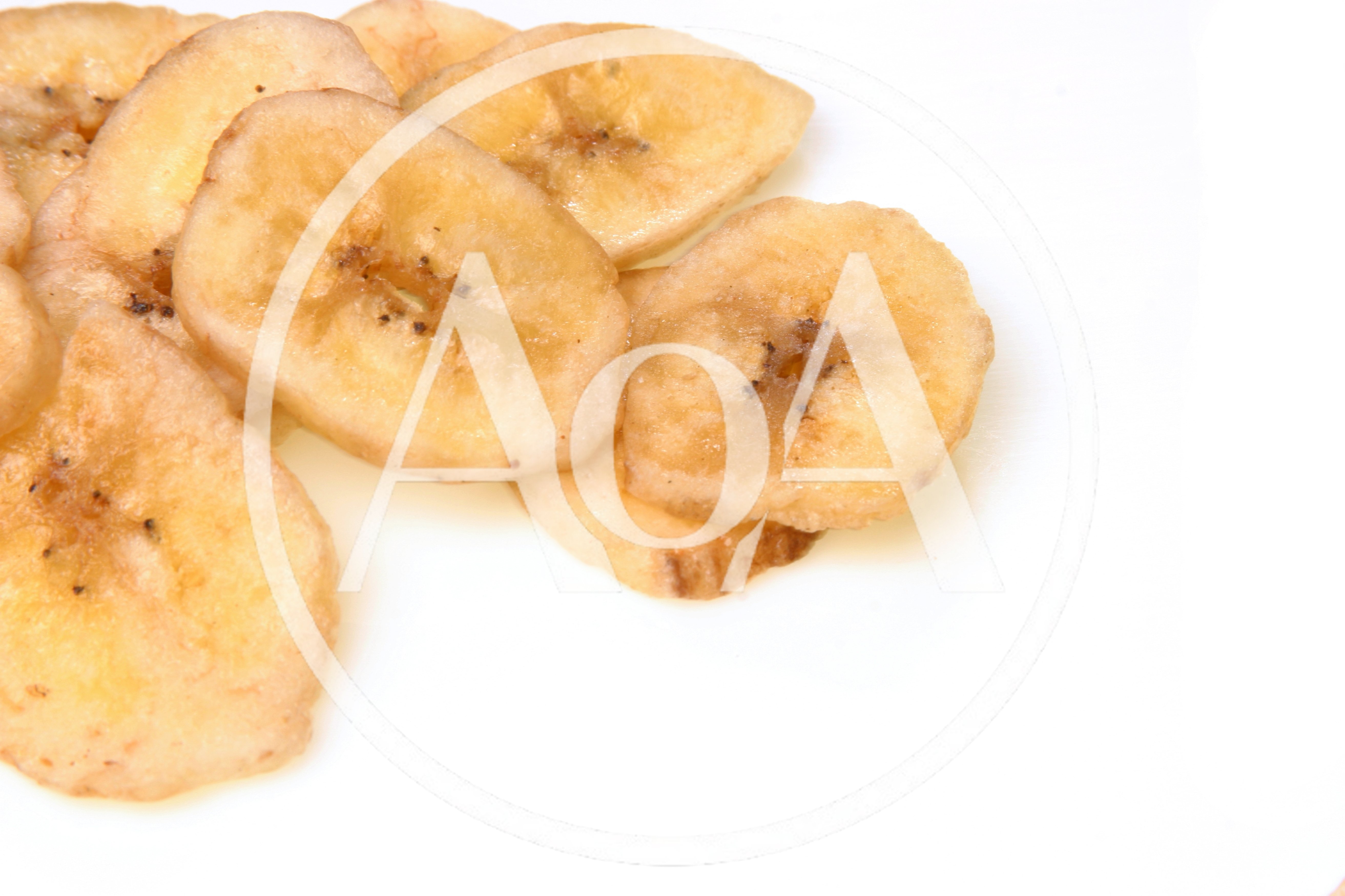 Dried Banana Chips On A White Background