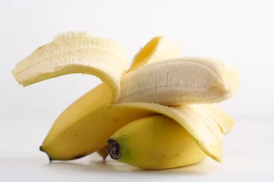 Peeled Ripe Banana Fruit On White Background