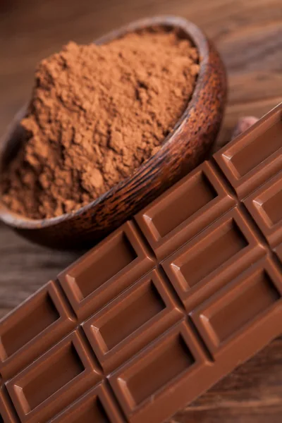 Milk Chocolate Bar And Cocoa Powder In Wooden Bowl