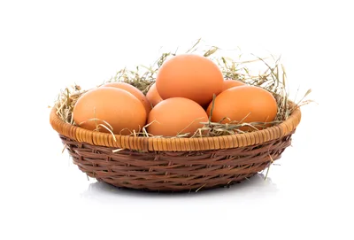 Fresh Brown Chicken Eggs In A Woven Basket