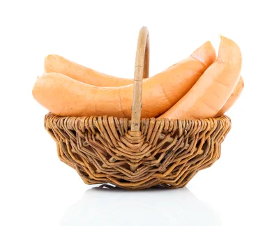 Fresh Sausages In A Woven Wicker Basket