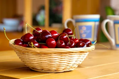 Fresh Red Cherries In A Wicker Basket
