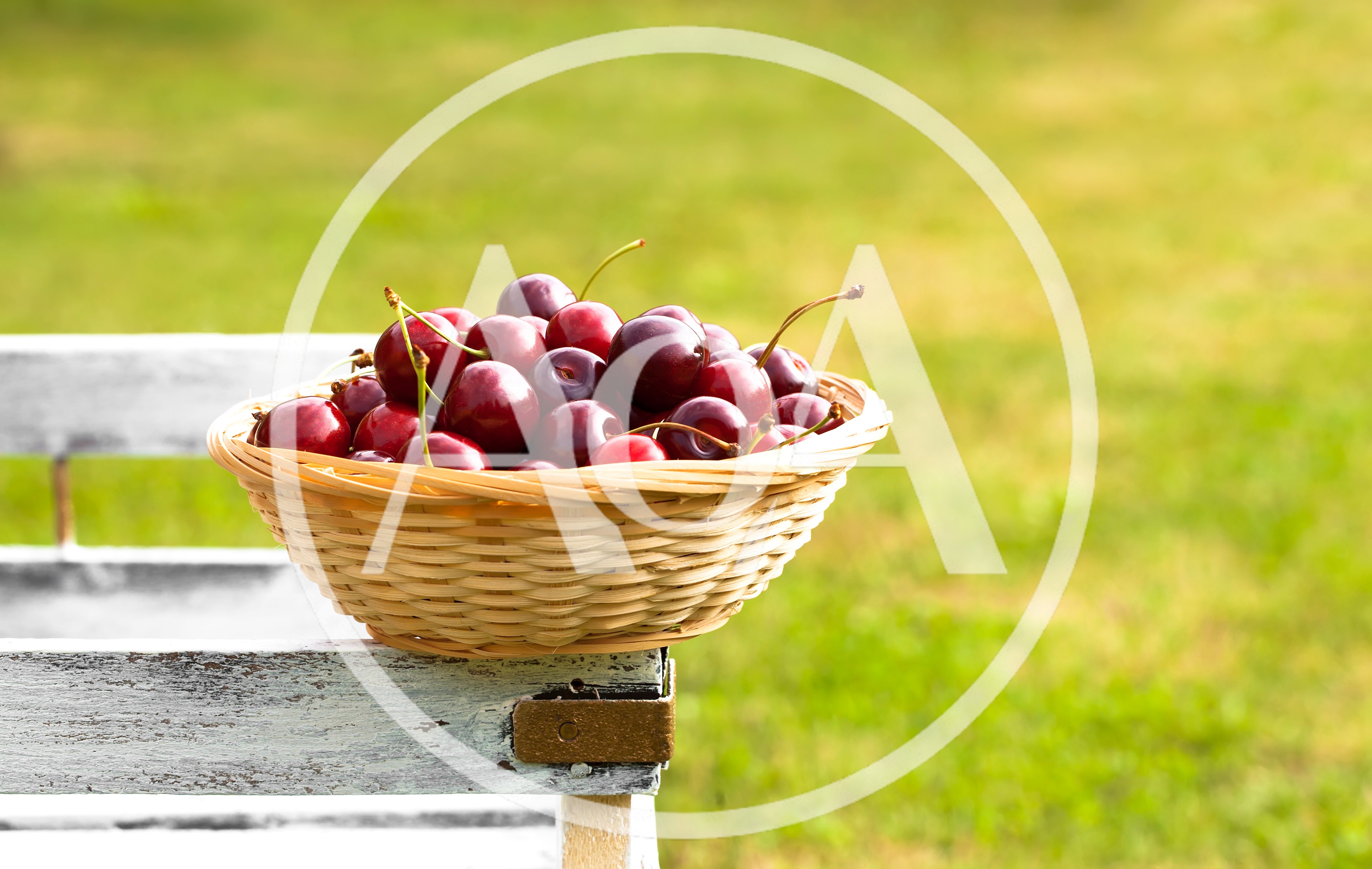 Fresh Red Cherries In A Wicker Basket