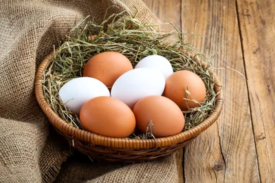 Fresh Chicken Eggs In A Woven Basket