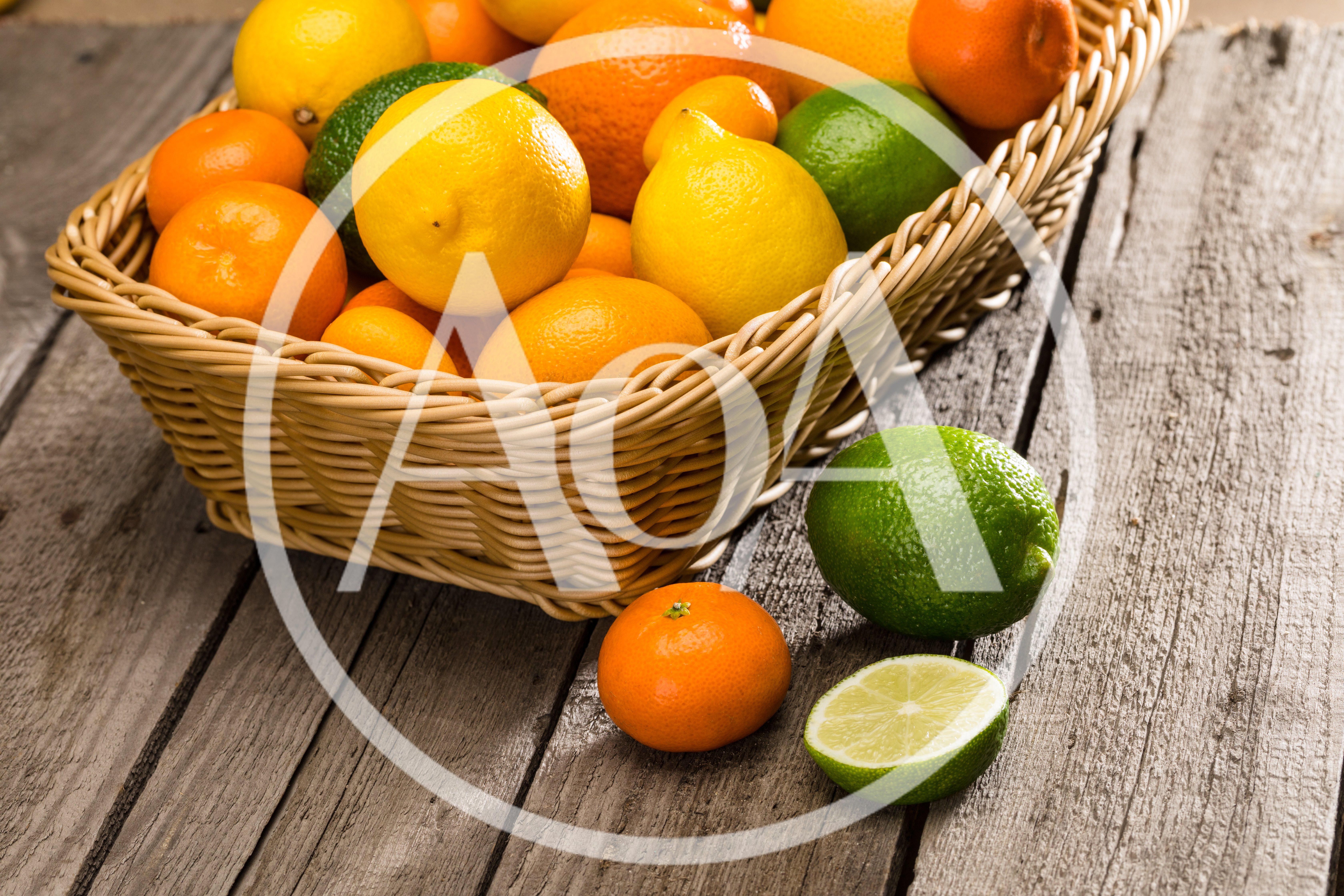 Fresh Citrus Fruits In A Wicker Basket