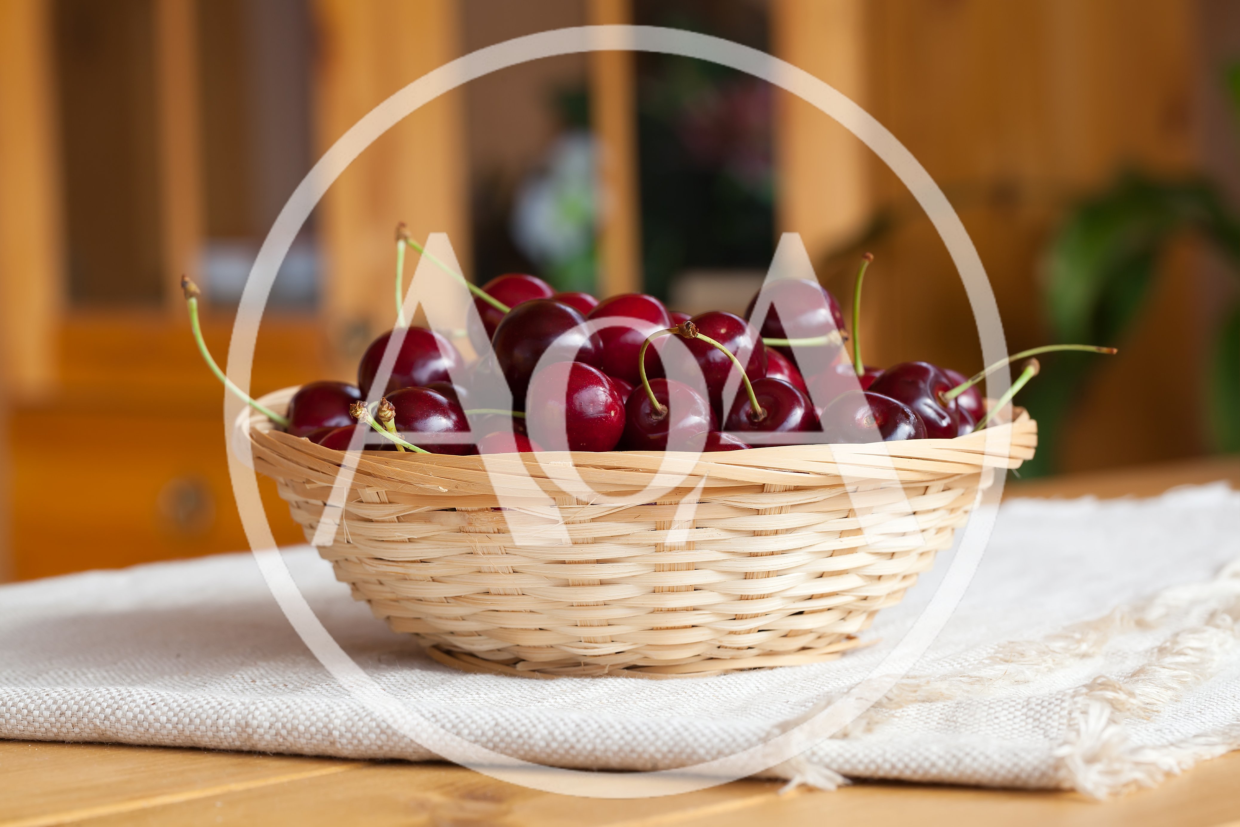 Fresh Red Cherries In A Woven Basket