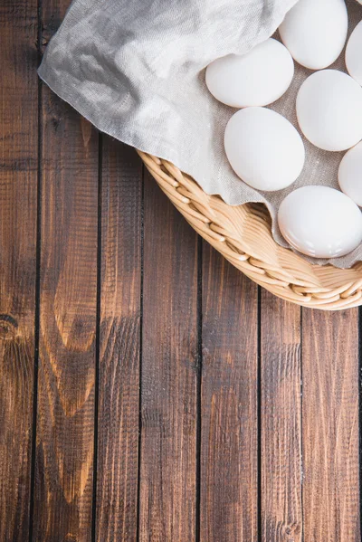 White Chicken Eggs In A Wicker Basket