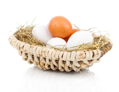 Fresh Chicken Eggs In A Woven Straw Basket