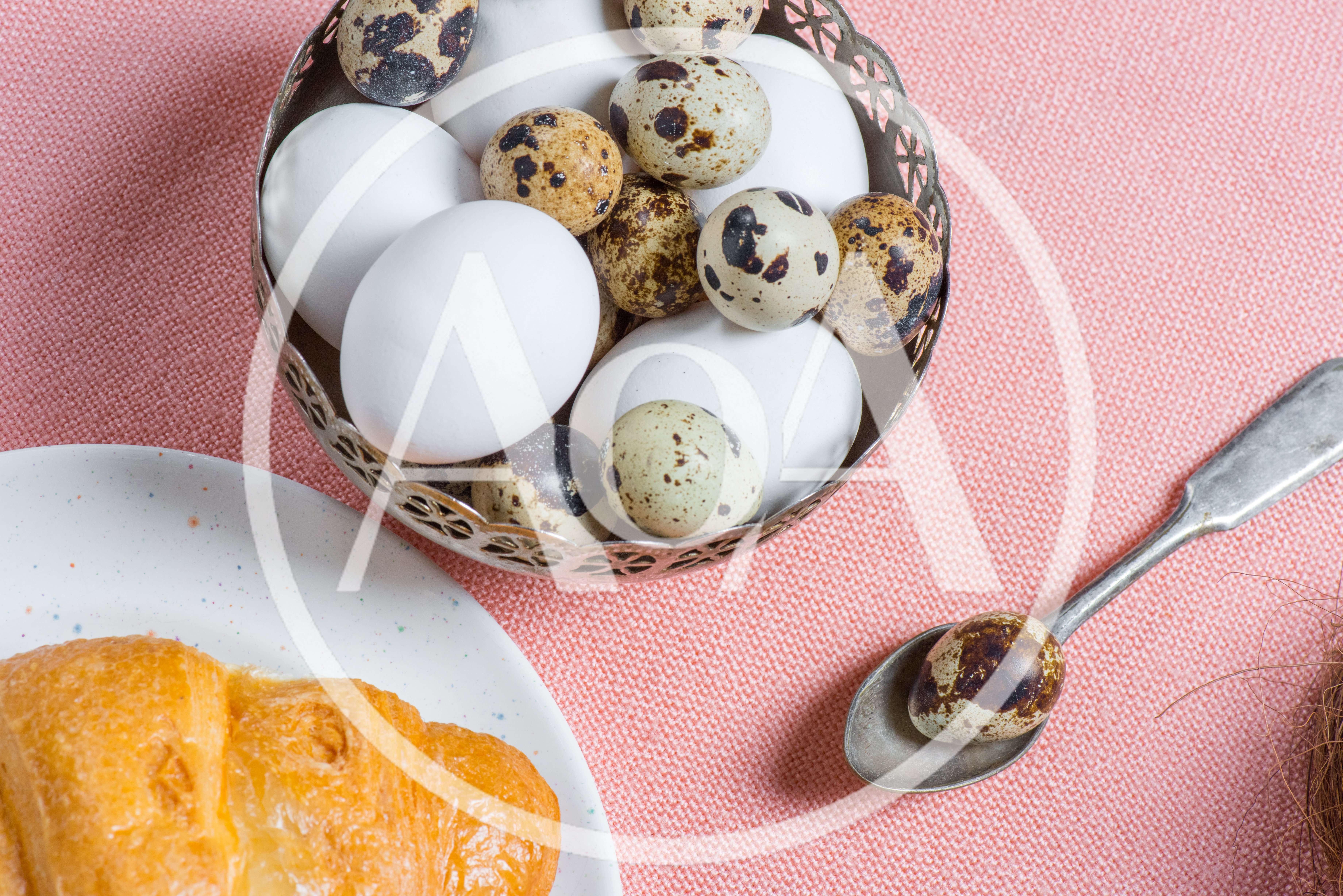 Quail Eggs And Croissant On A Pink Tablecloth