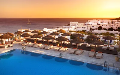 Luxury Resort Swimming Pool At Sunset In Greece