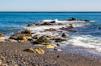 Ocean Waves Crashing Against Rocky Shoreline