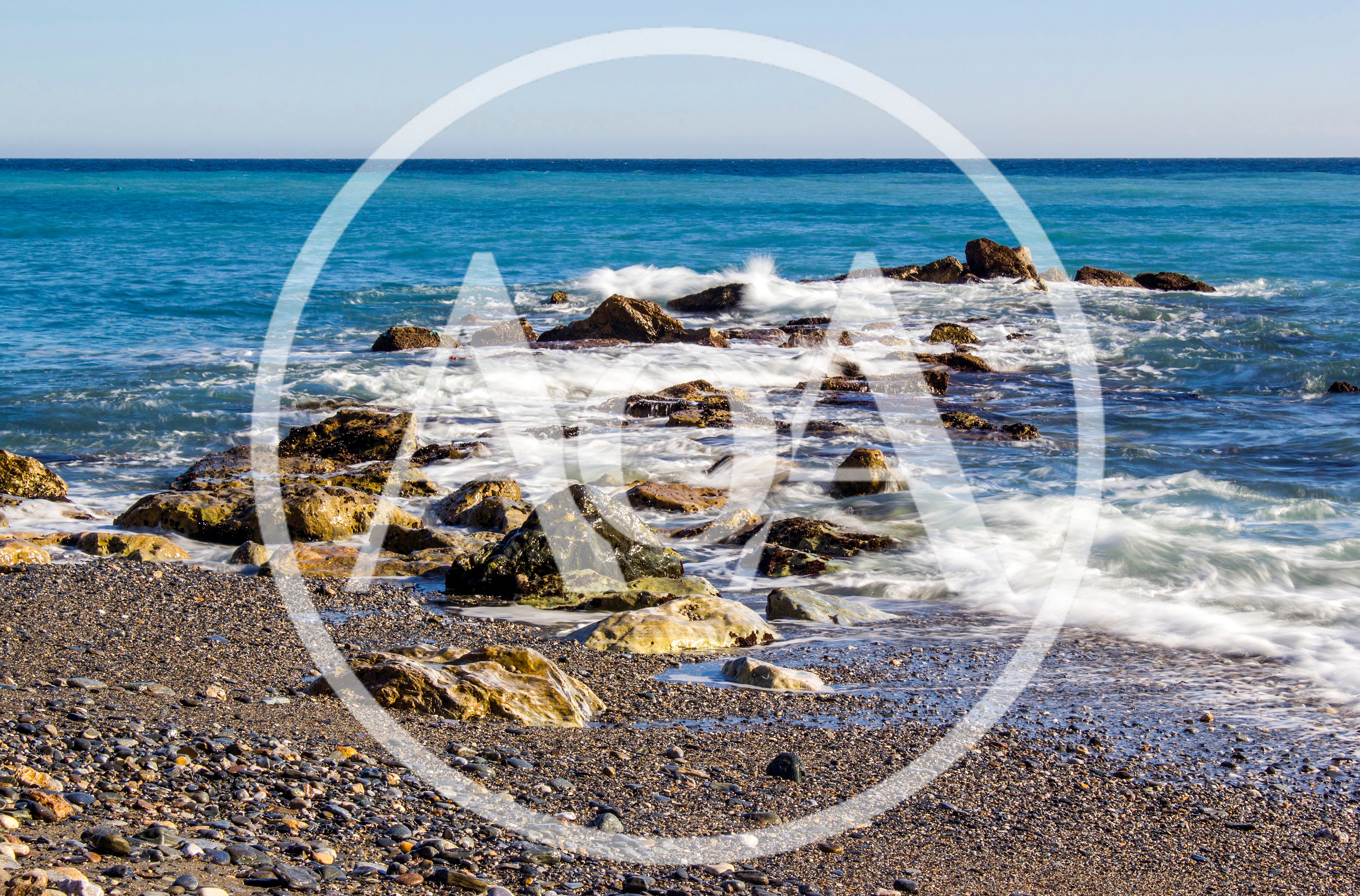 Ocean Waves Crashing Against Rocky Shoreline