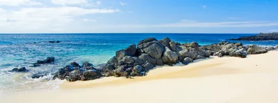 Volcanic Rock Formation On A Tropical Beach