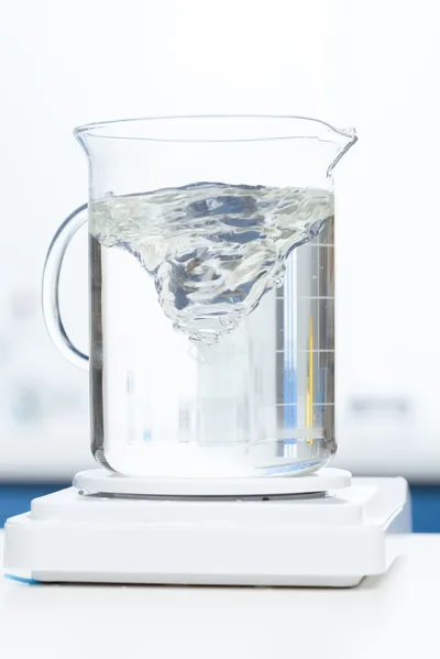 Laboratory Beaker With Spinning Liquid Vortex