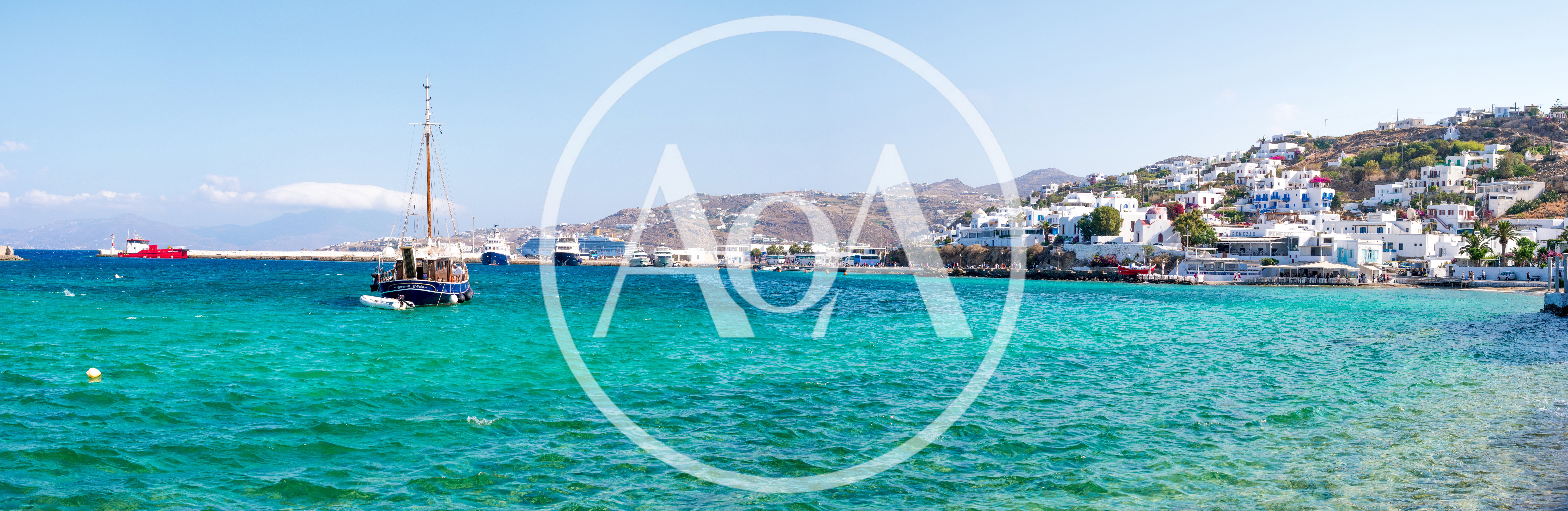 Panoramic View Of Mykonos Harbor With Traditional Boat