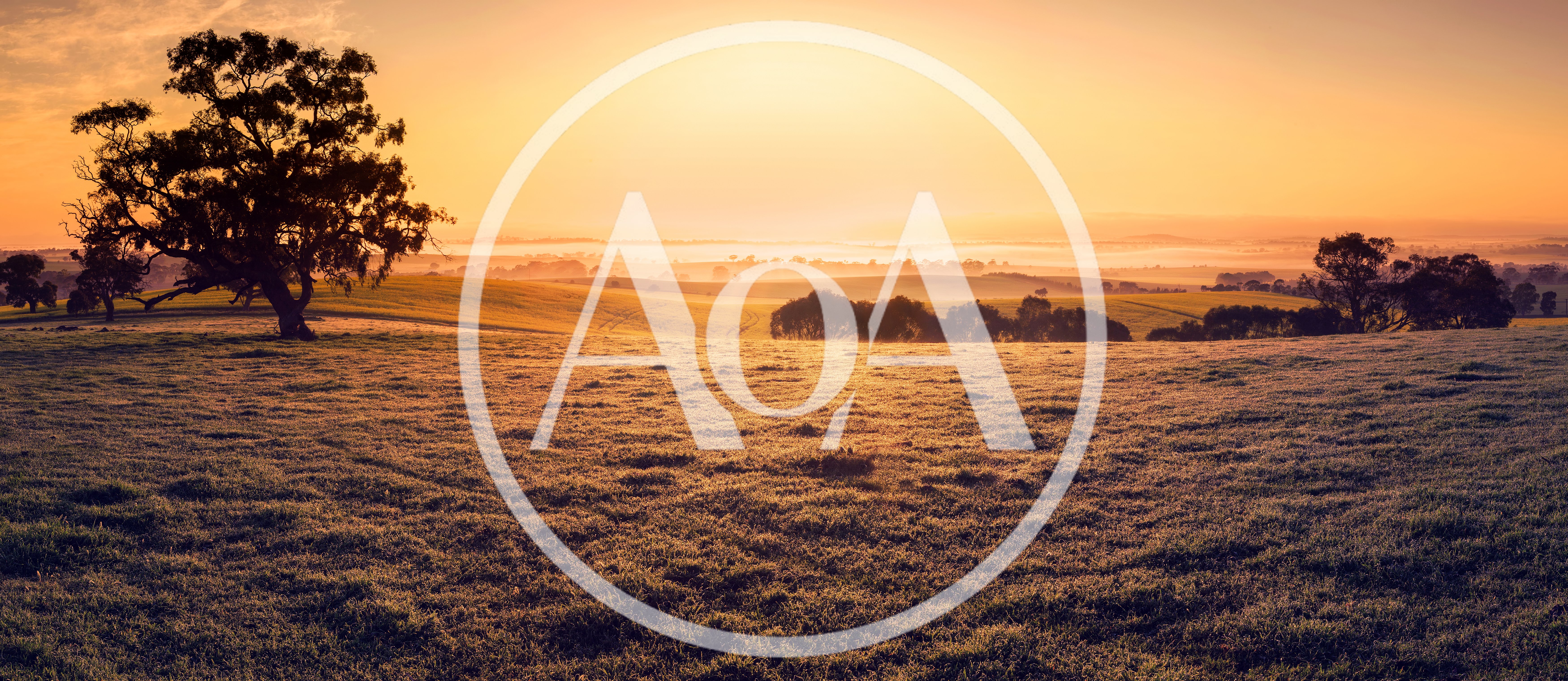 Golden Sunrise Over A Rolling Rural Landscape