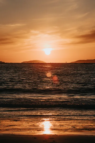Golden Sunset Over The Ocean Horizon