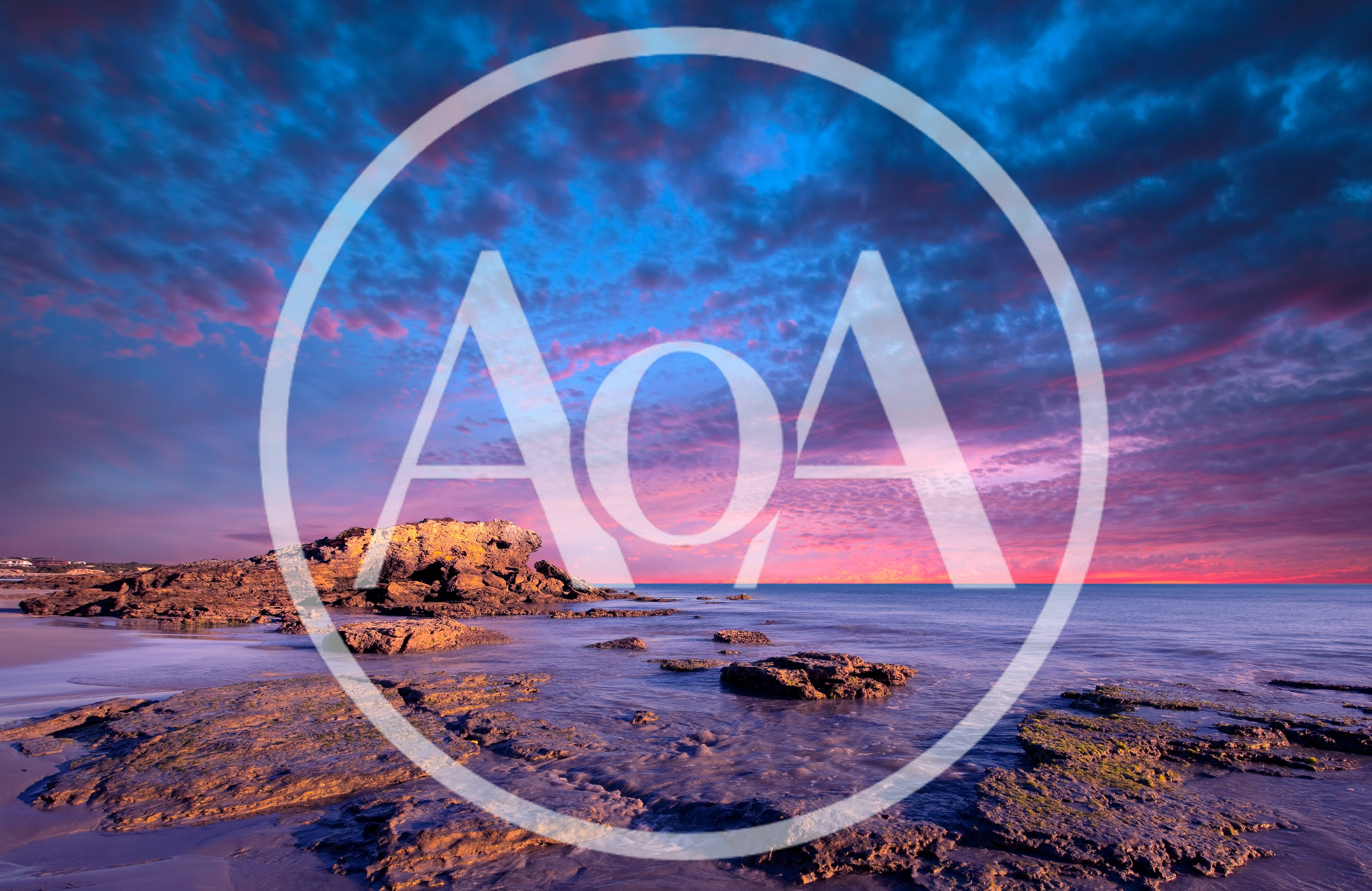 Rocky Beach Shoreline at Sunset with Vibrant Clouds