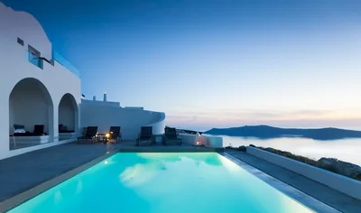 Luxury Infinity Pool Overlooking Santorini Caldera At Sunset