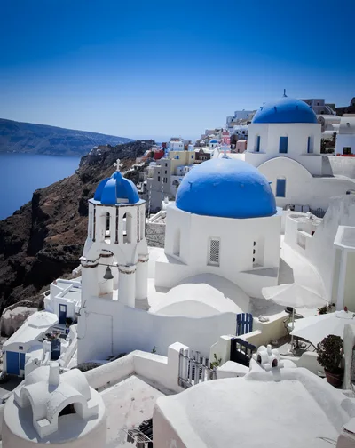 Iconic Blue Domed Churches In Oia Santorini Greece