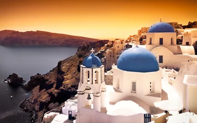 Iconic Blue Domed Churches In Oia Santorini Greece