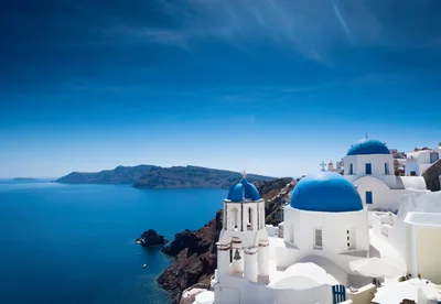 Iconic Blue Domed Churches In Oia Santorini Greece