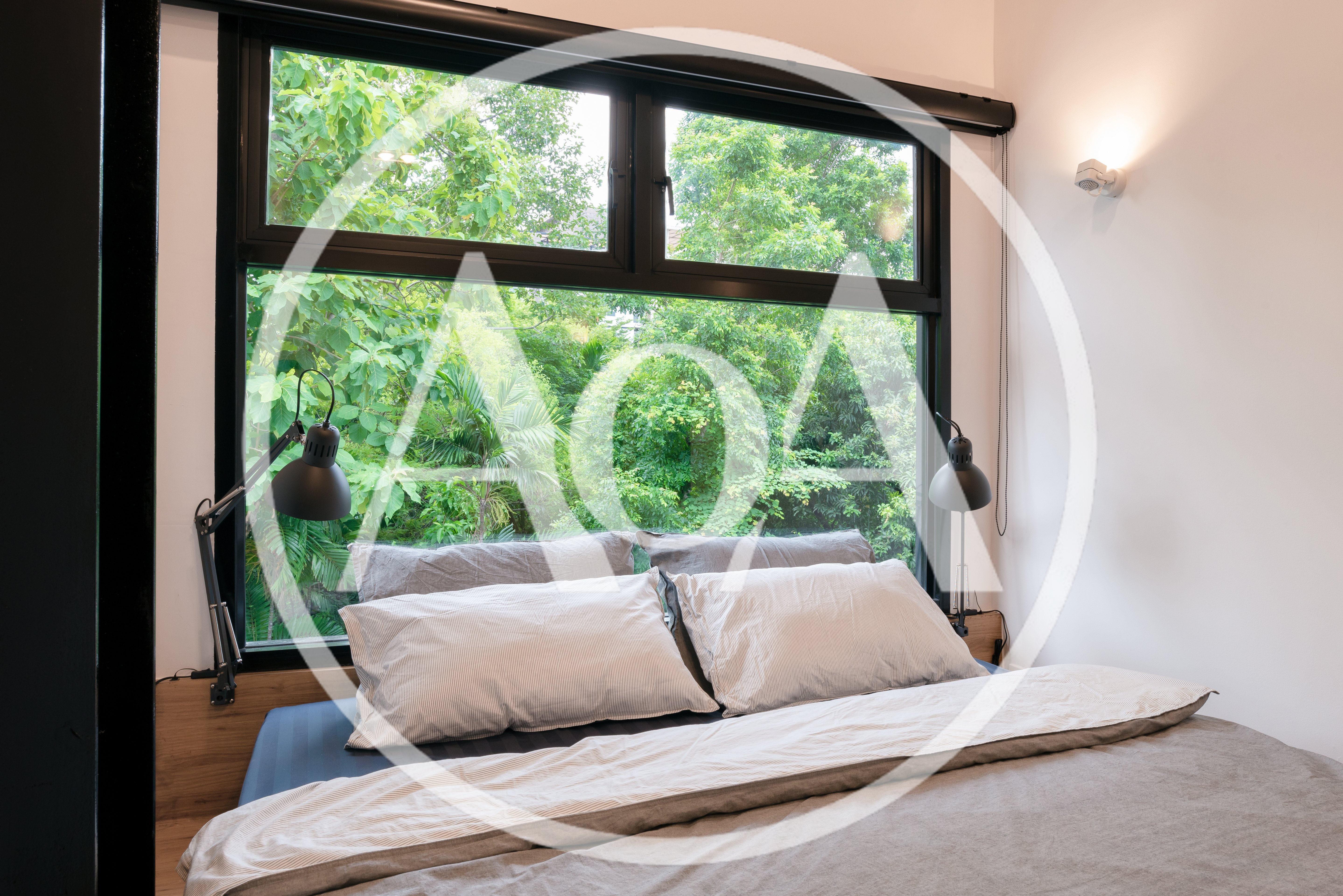 Modern Bedroom With Large Window Overlooking Lush Greenery